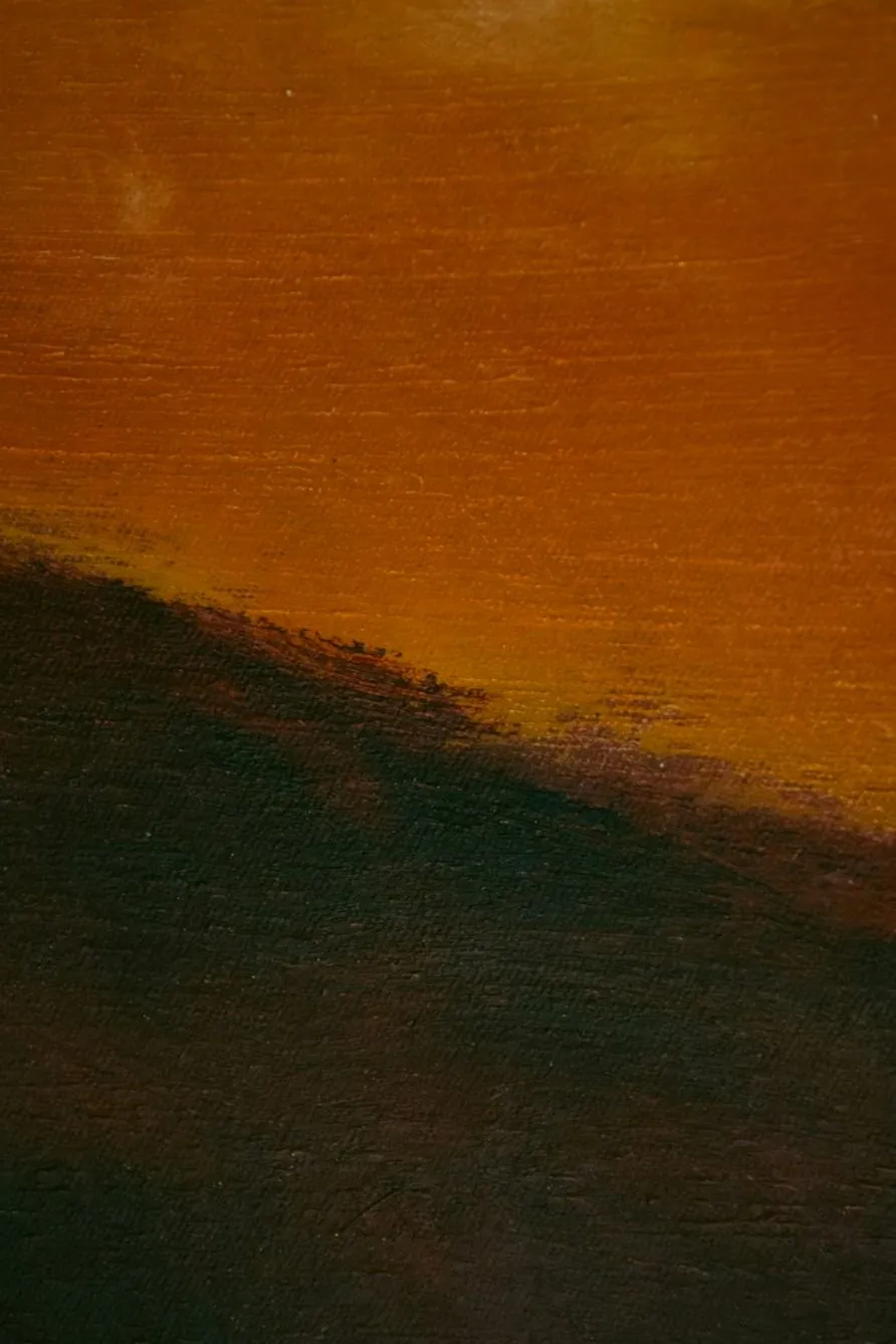 Detail of an oil painting: an amber sky over a dark green hillside